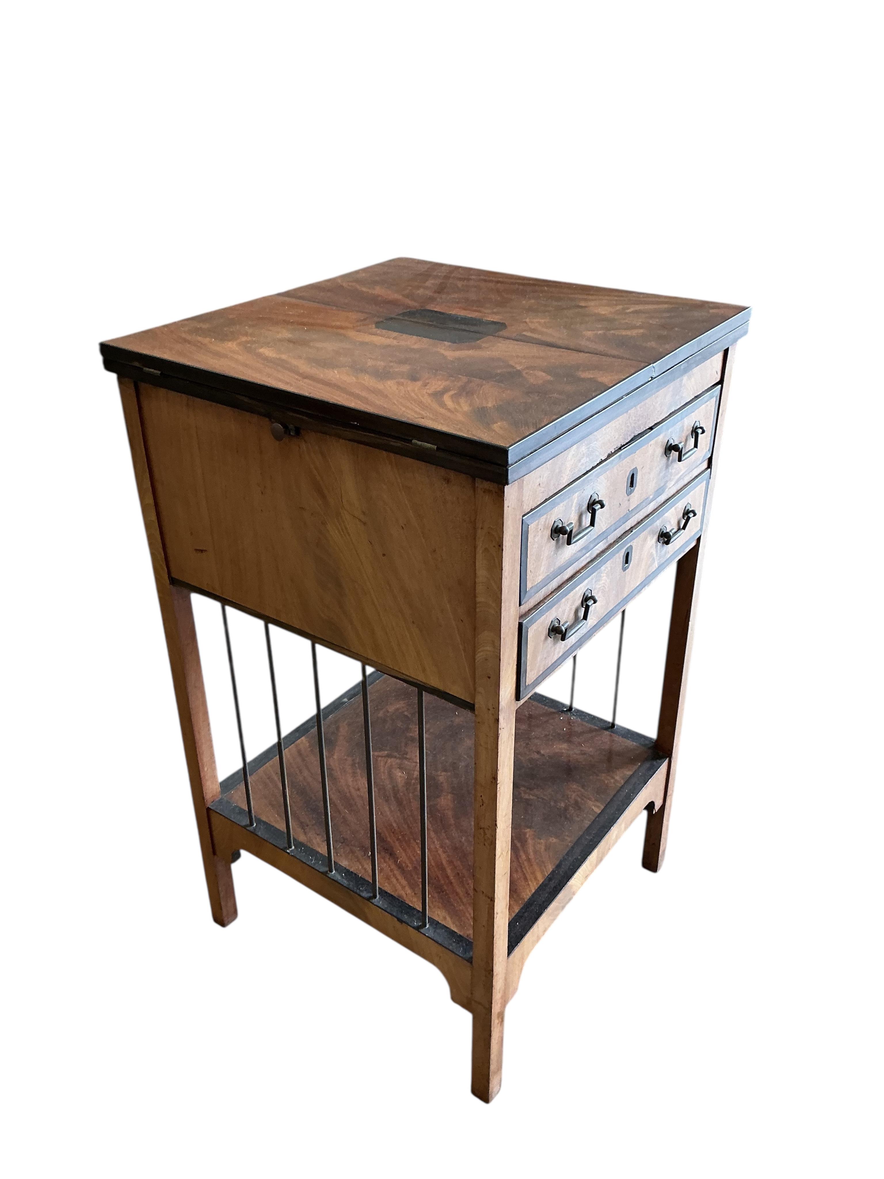 A George III ebony banded mahogany two drawer writing table, with leather lined twin flap top, width 48cm, depth 47cm, height 81cm